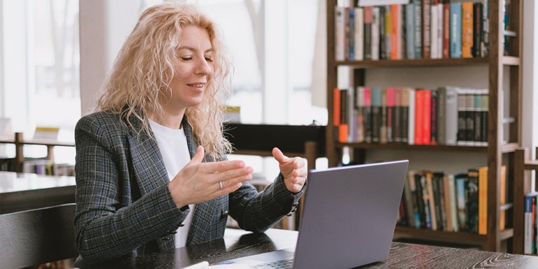 educator in front of computer